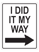 A white rectangular sign in the style of One Way signs but this one says I Did It My Way instead