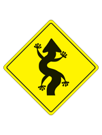 A yellow caution diamond in the style of the swerving road sign with legs added to make the arrow look like a lizard