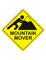 A yellow caution diamond with the words Mountain Mover and a pictogram of a person pushing a mountain