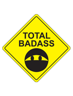 A ninja emoji on a yellow diamond with the words Total Badass